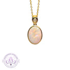 14kt Yellow Gold Oval White Opal Red 2.25ct bezel set pendant