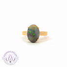 9kt Yellow Gold solitaire Black Opal 3.85ct claw set ring