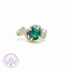 18kt White Gold curved band Black Opal and diamond ring