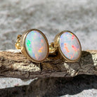 One pair of 9kt Yellow Gold Light Opal earring studs 7x5mm bezel set - Masterpiece Jewellery Opal & Gems Sydney Australia | Online Shop