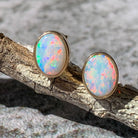 One pair of 9kt Yellow Gold Light Opal earring studs 7x5mm bezel set - Masterpiece Jewellery Opal & Gems Sydney Australia | Online Shop